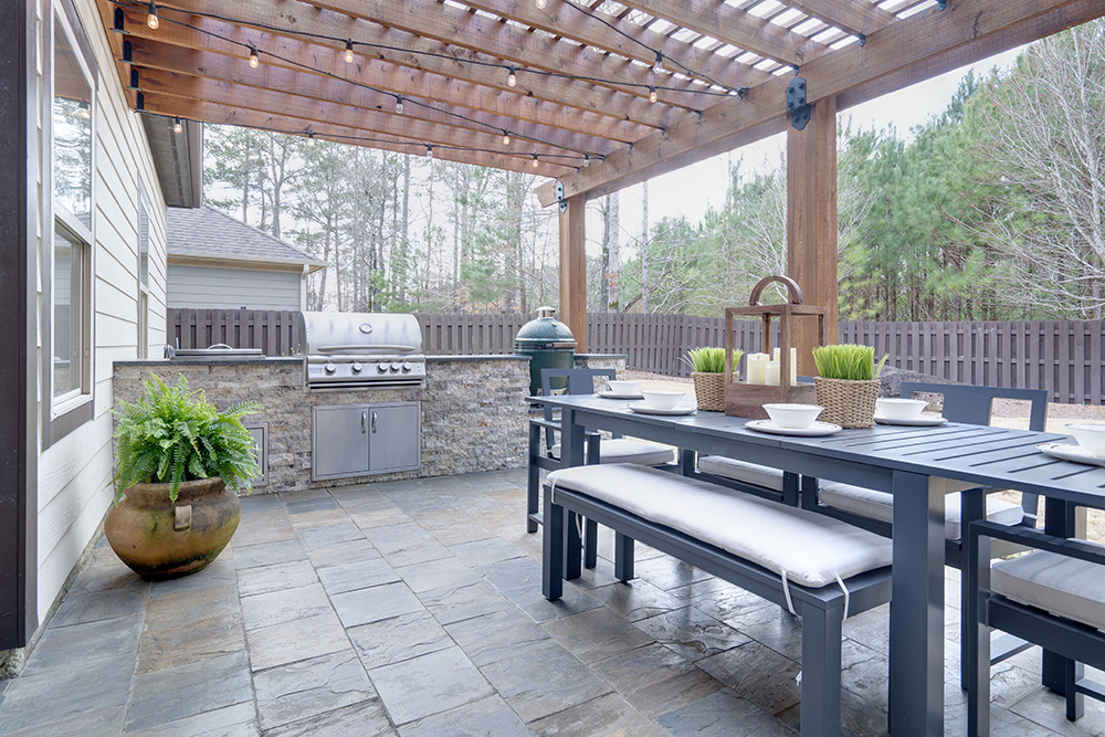 A patio kitchen with seating