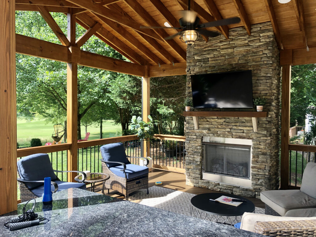 An outdoor living area with a fireplace in Charlotte, NC
