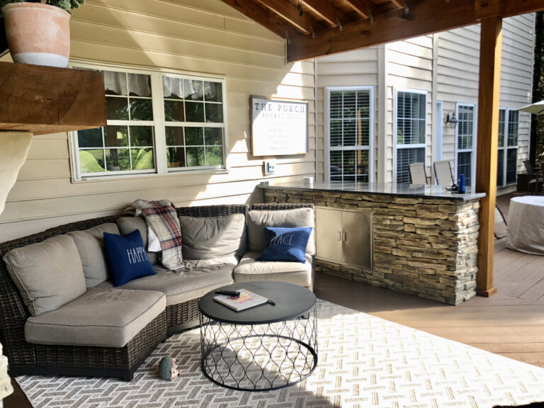 A porch with a gas fireplace
