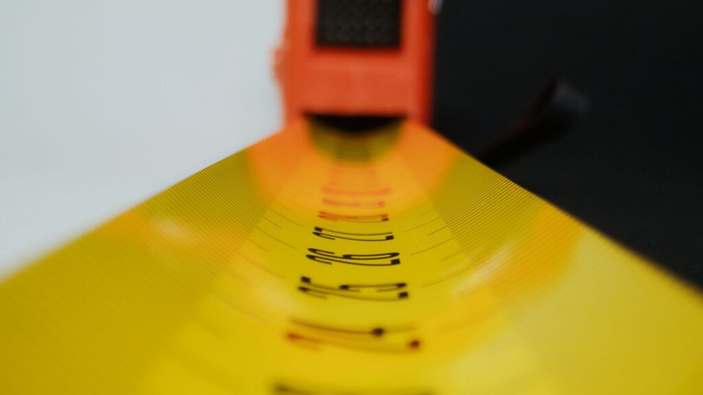 A close-up view of yellow measuring tape